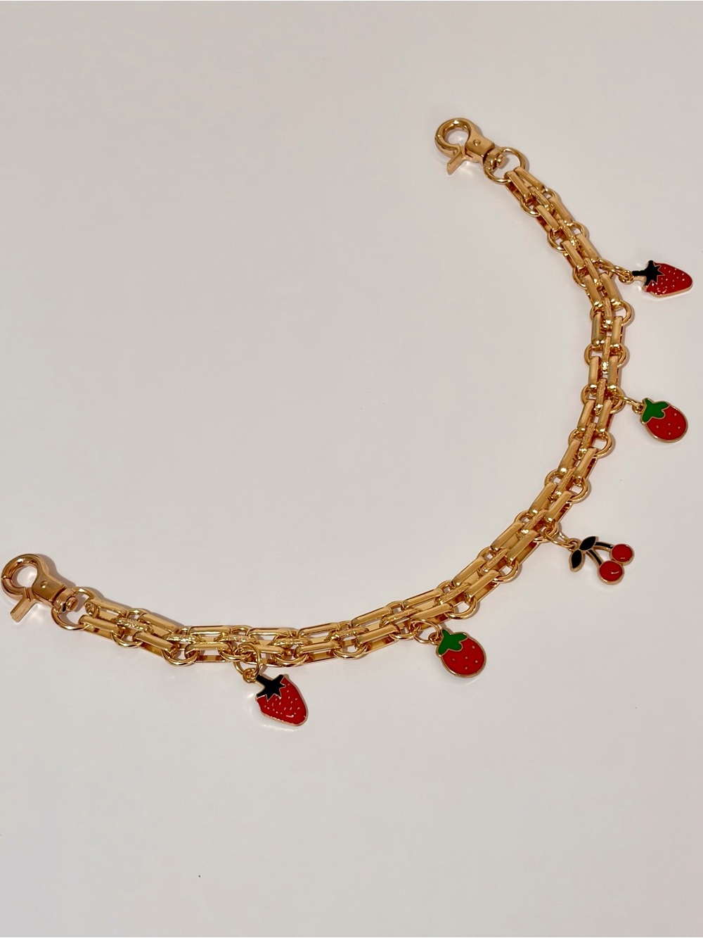 Gold-Tone Fruit Charm Bag Chain with Red Fruit Charms